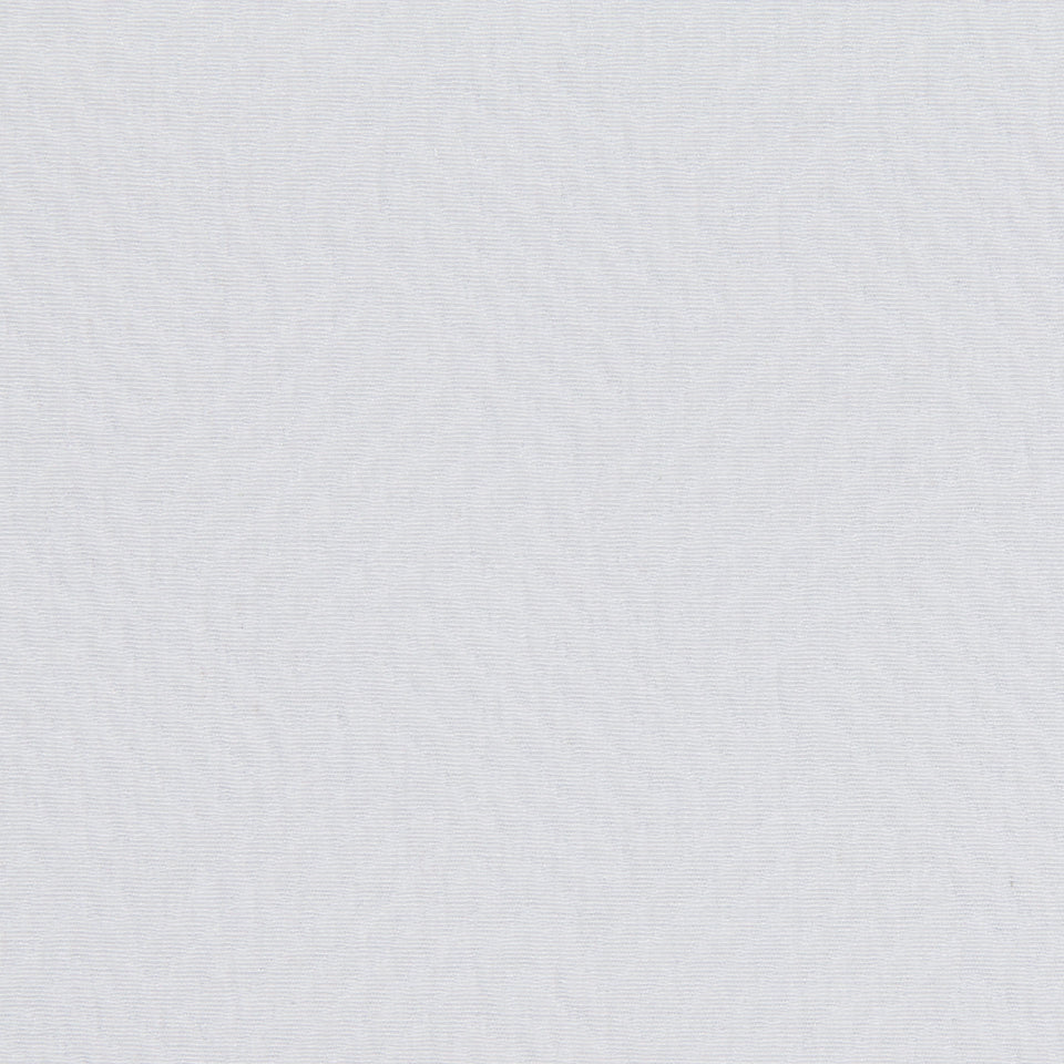 Close-up of white upholstery fabric showing a subtle diagonal weave texture