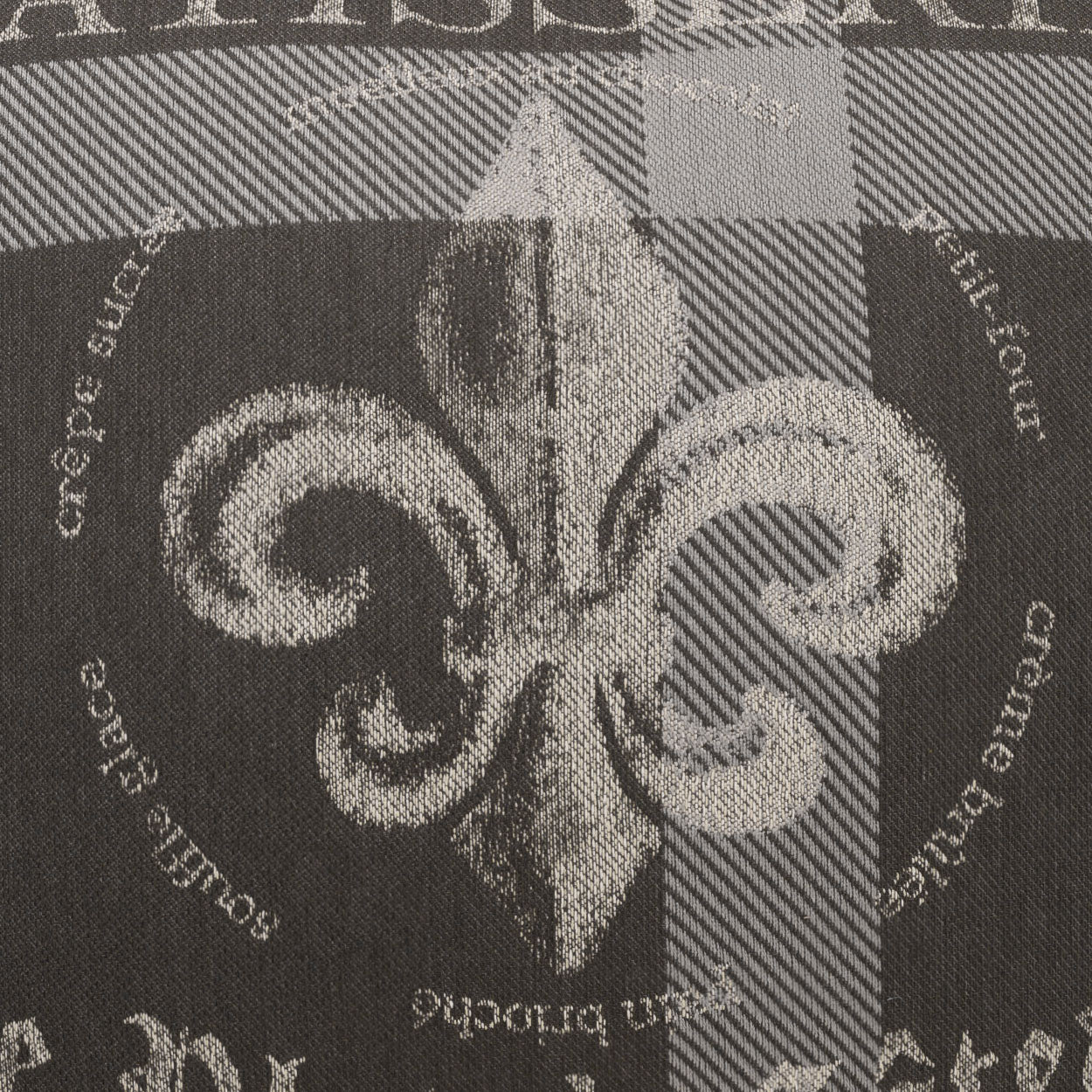 Gray and black plaid fabric with a white fleur-de-lis motif, decorative upholstery textile.