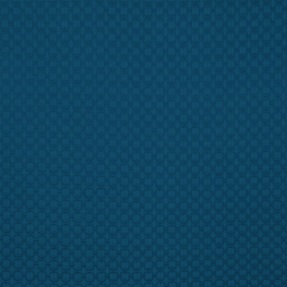 Cobalt fabric with a subtle repeating circular pattern and smooth texture.
