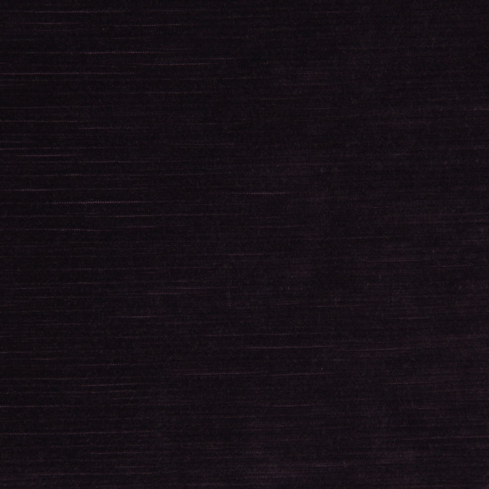 Dark charcoal velvet upholstery fabric with a soft nap and matte finish.
