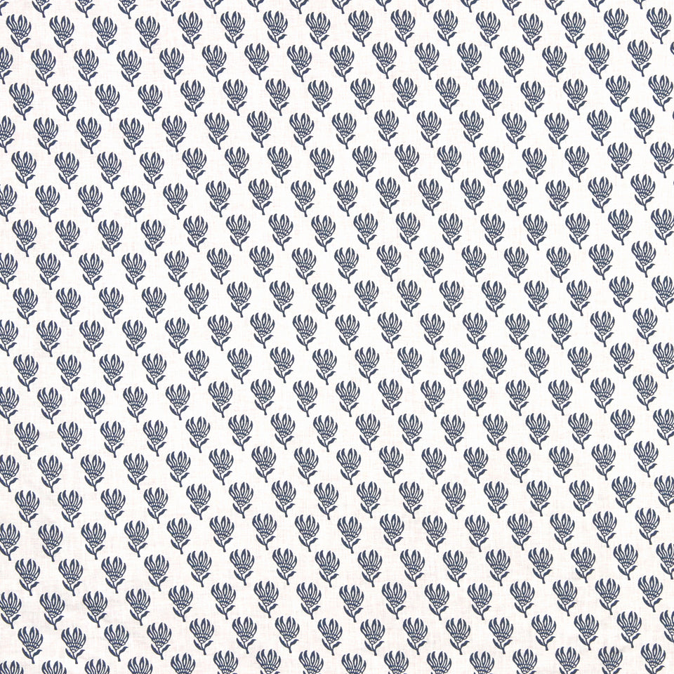 Repeating navy blue floral sprig pattern on light beige background; botanical fabric or wallpaper design.