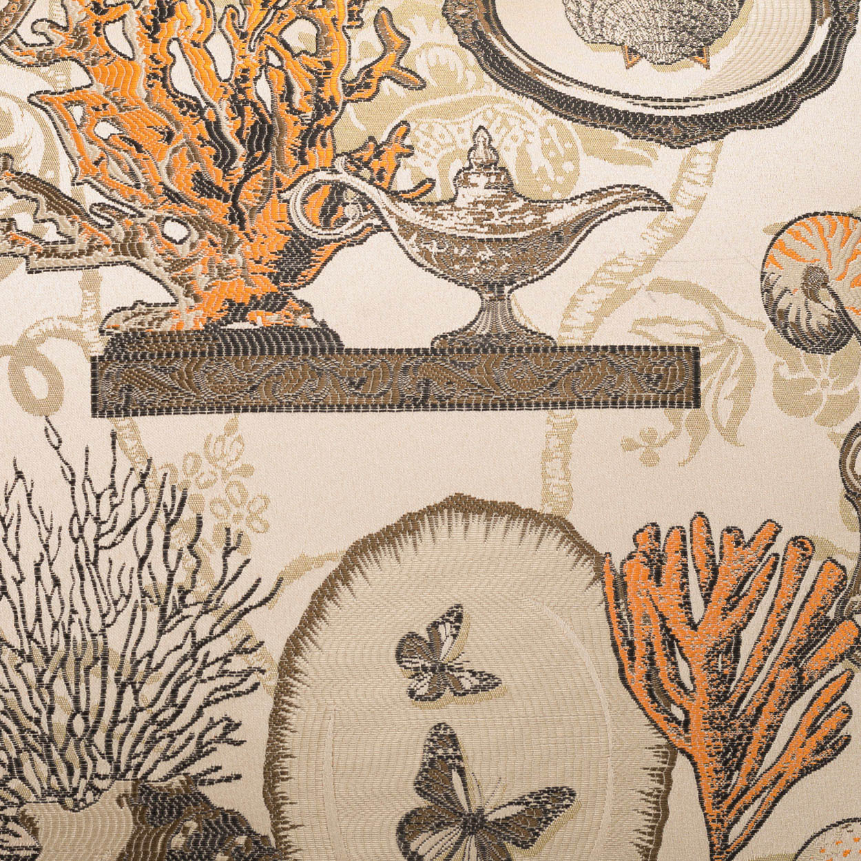 Beige pillow featuring coral, seashells and butterflies in a vintage nautical botanical pattern.