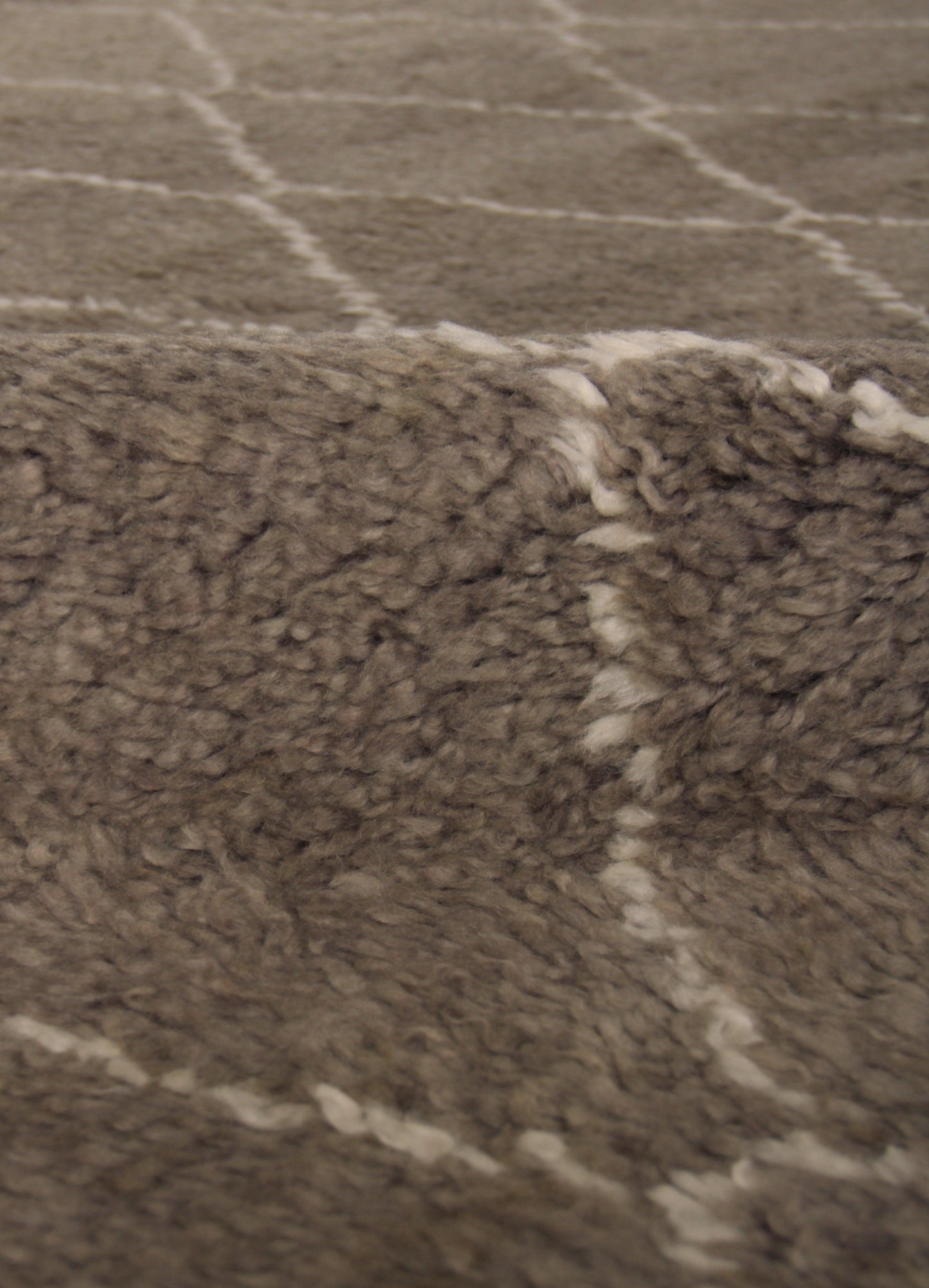 Brown Moroccan indoor hand-knotted rug; soft, textured pile