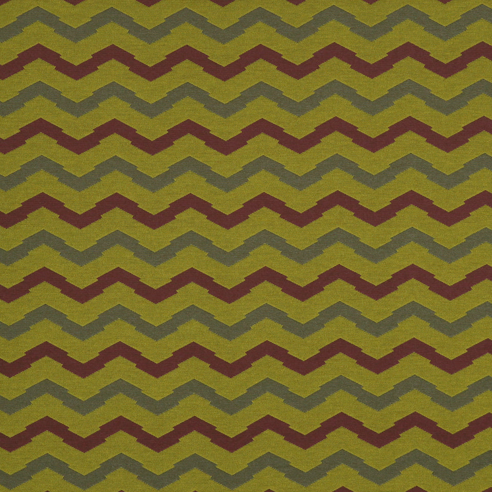 Textured upholstery fabric with repeating olive and rust chevron zigzag pattern.