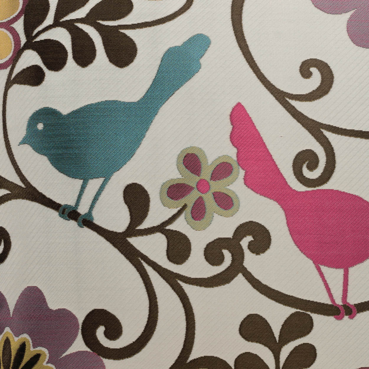 Cream fabric with teal blue and pink birds perched on brown swirling vines and colorful flowers.