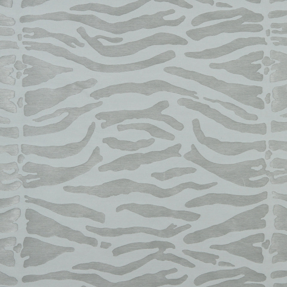 Muted gray zebra stripe pattern on textile; soft wavy lines suitable for rug or wallpaper.