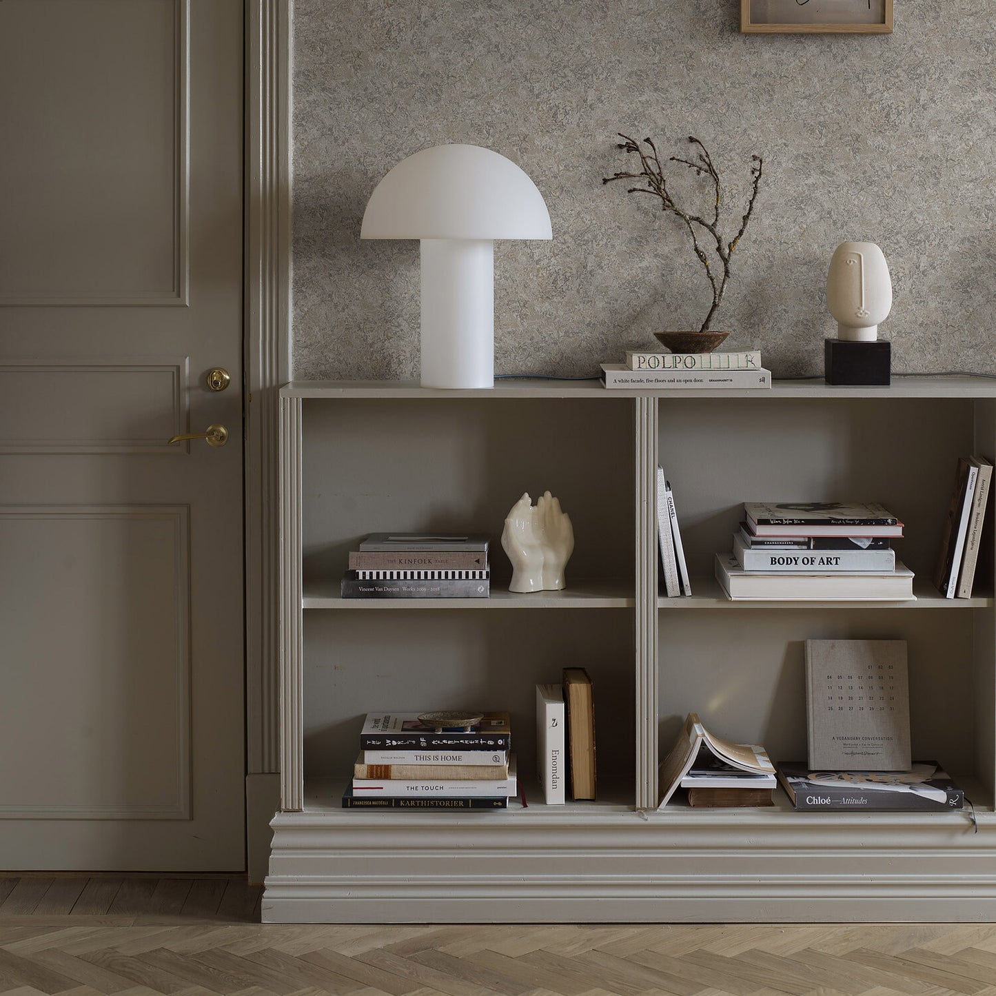 Neutral travertine natural wallpaper pattern on a wall in a chic living space.