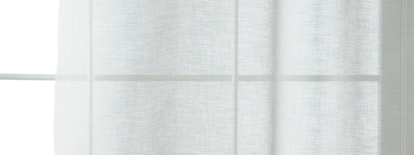 White sheer curtains draped over a window, light-filtering, airy minimalist style.