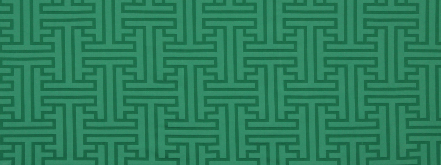 Teal-green Greek key meander geometric pattern on upholstery fabric.