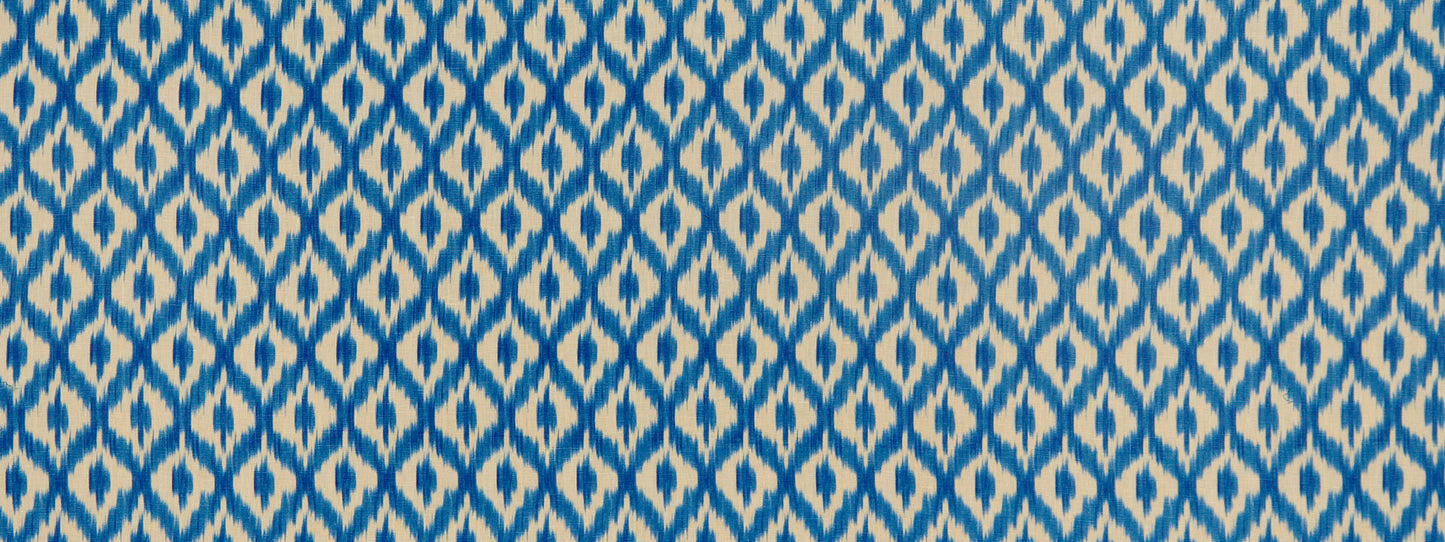 Blue and white ikat-inspired geometric fabric pattern with diamond motifs, suitable for upholstery or apparel.