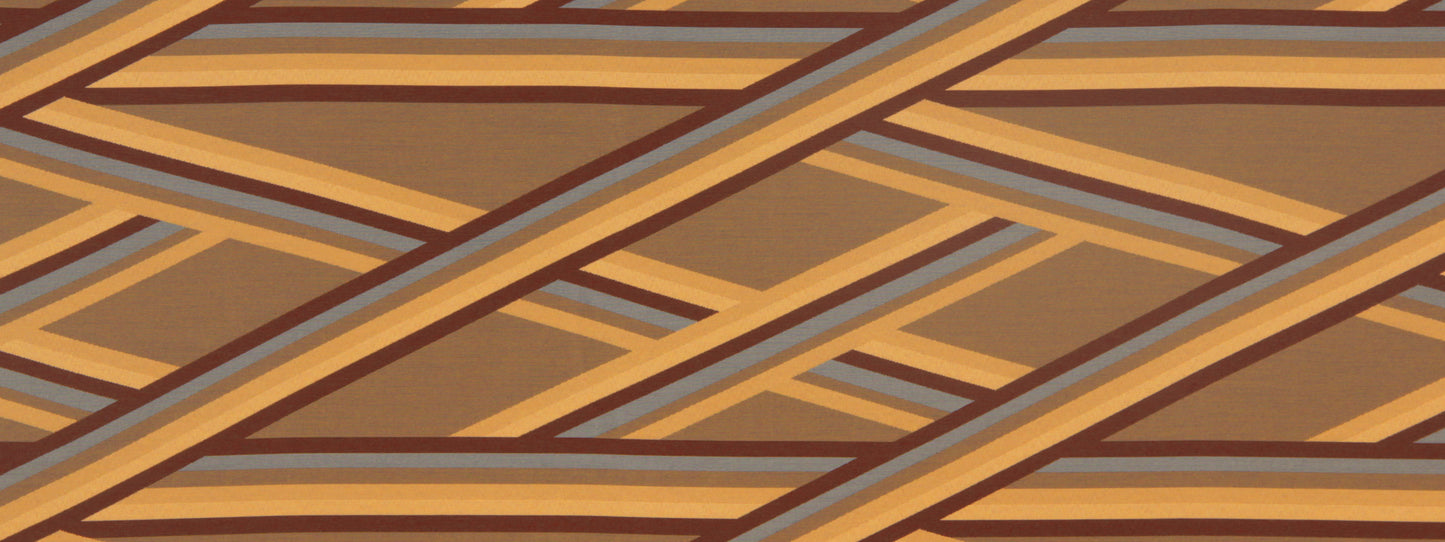Close-up of oxblood upholstery fabric with a geometric banderoles pattern.