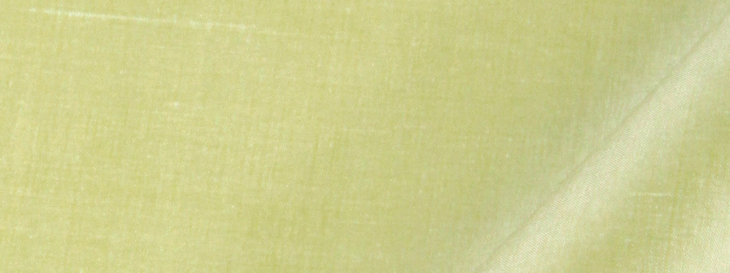 Close-up of lime-green silk fabric with visible weave texture.