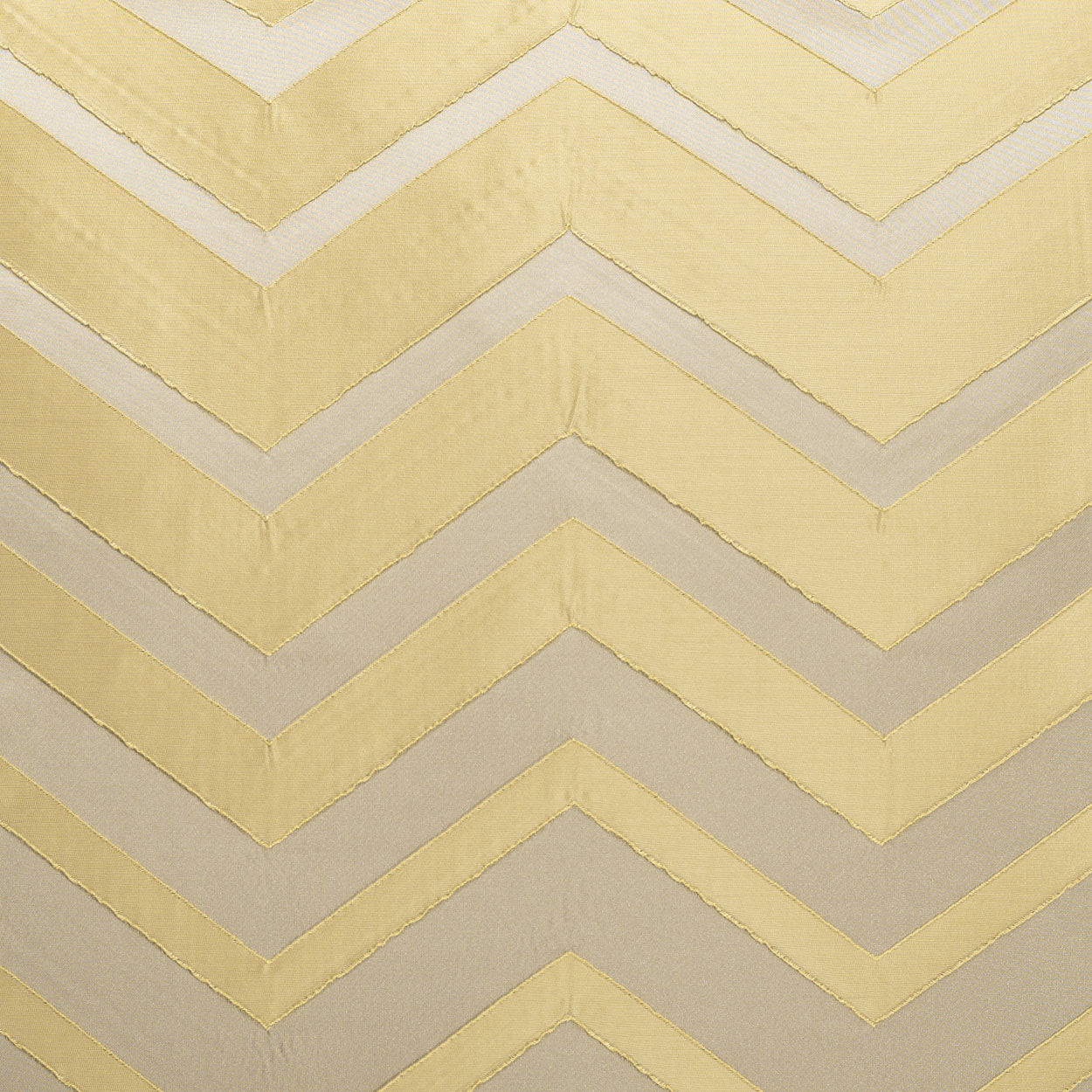 Gold chevron zigzag fabric pattern on pale beige background; metallic gold stripes, contemporary textile.