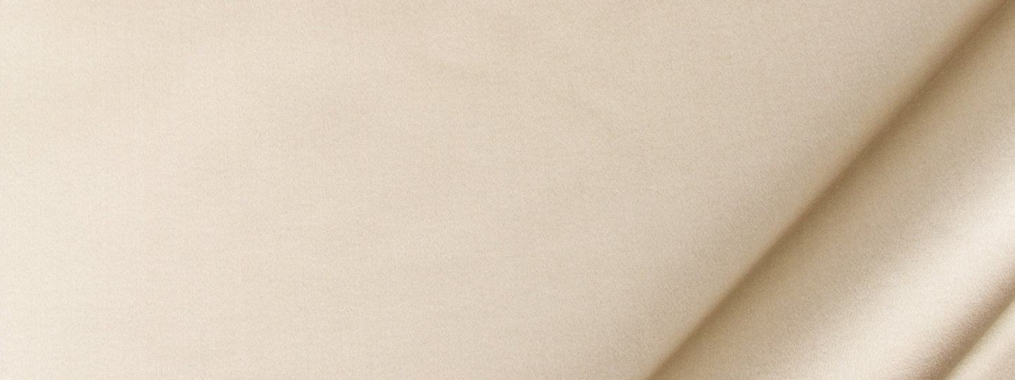 Beige satin drapery fabric with a soft drape and gentle folds.