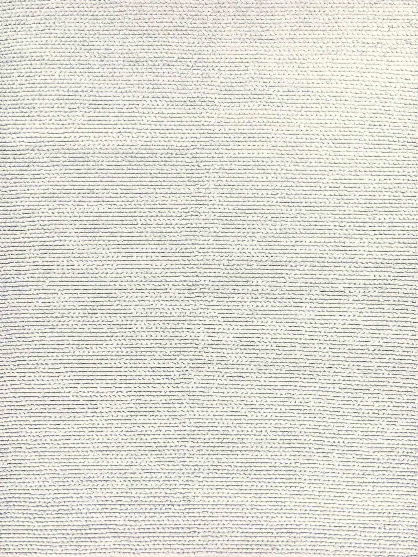 Light gray textured rug with a fine ribbed pattern; handwoven rectangle rug.
