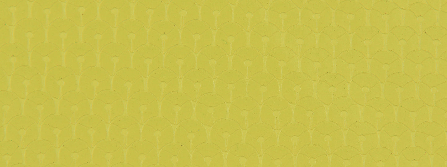 Chartreuse upholstery fabric with a shimmering sequin pattern and a repeating geometric texture.
