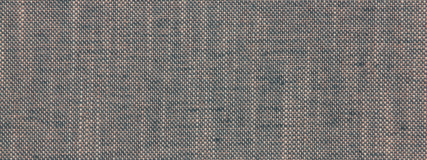 Blue cobalt linen canvas upholstery fabric close-up with a woven texture and tiny tan specks.