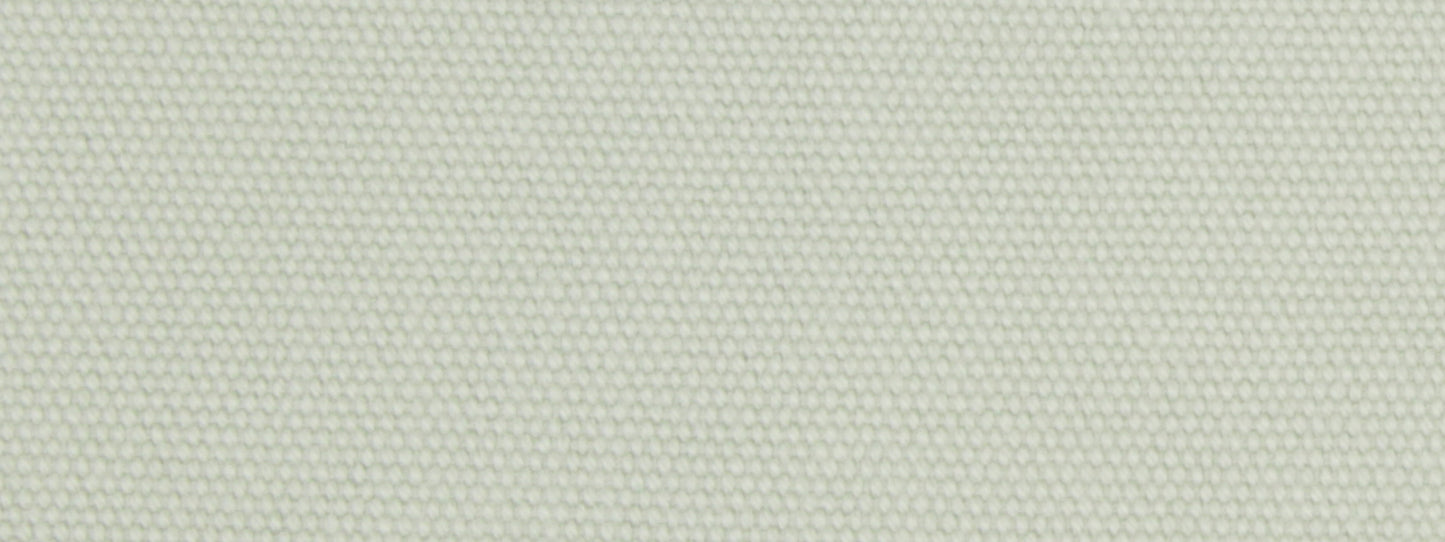 Close-up of mint green woven upholstery fabric with a tiny dot texture; linen-like textile.