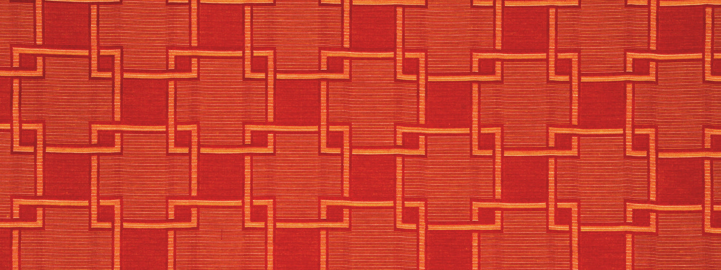 Orange woven fabric with interlocking square-link pattern; bold, warm geometric texture.