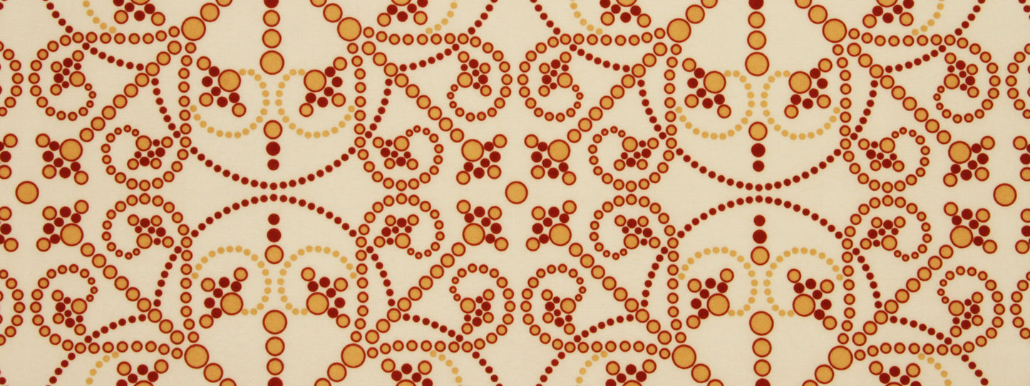 Beige textile with red-orange dotted circles in swirling, looping abstract motif.