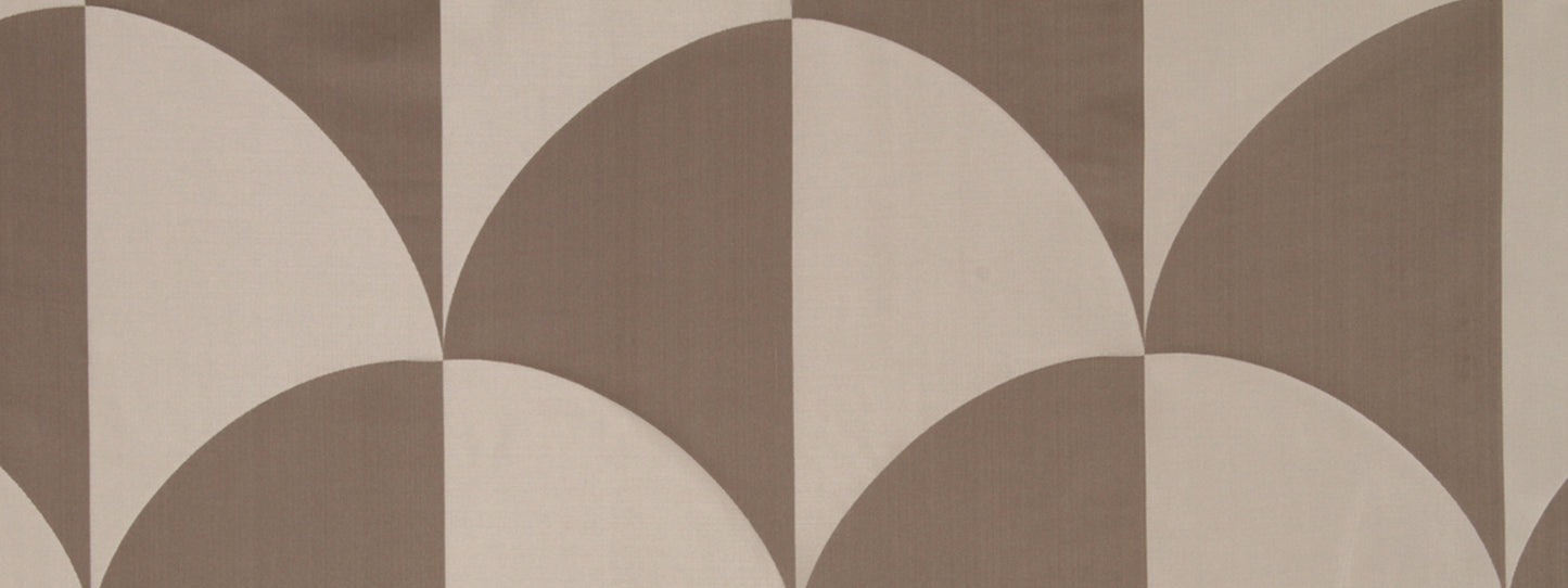 Geometric brown and beige fabric pattern with overlapping semicircles creating petal shapes in taupe and cream.