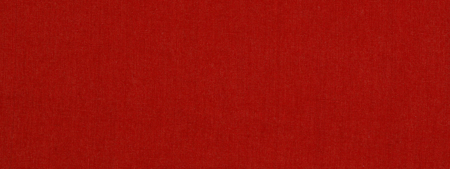 Solid red fabric texture close-up with subtle shading