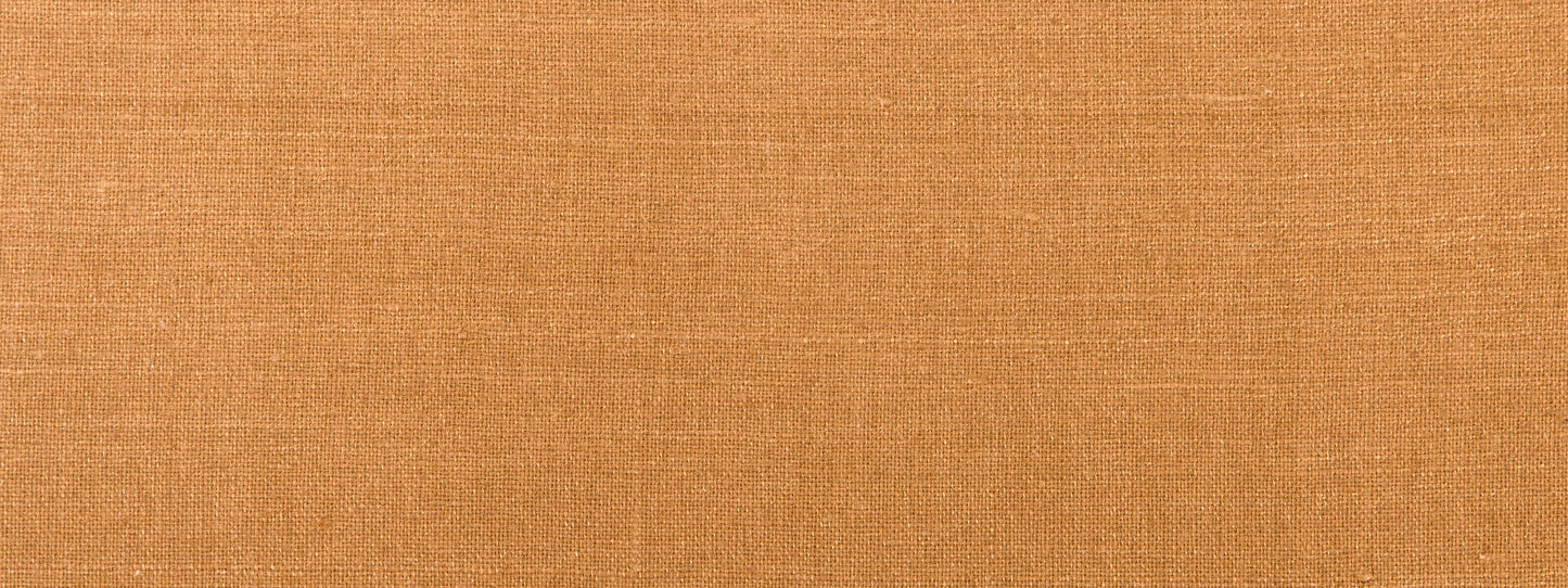 Close-up of orange-brown woven fabric texture.