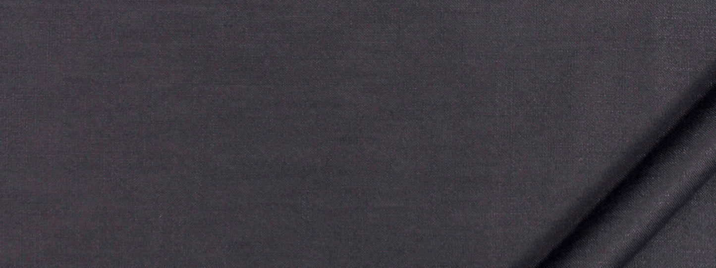 Charcoal grey fabric close-up showing soft weave and diagonal folds, versatile textile for apparel or upholstery