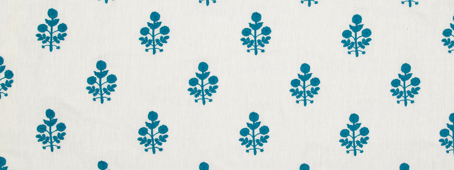 Turquoise blue floral motif repeating across a light background; decorative textile or wallpaper pattern.
