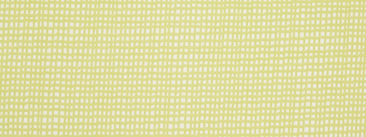 Close-up of lime upholstery fabric with a white square grid pattern and a soft woven texture.