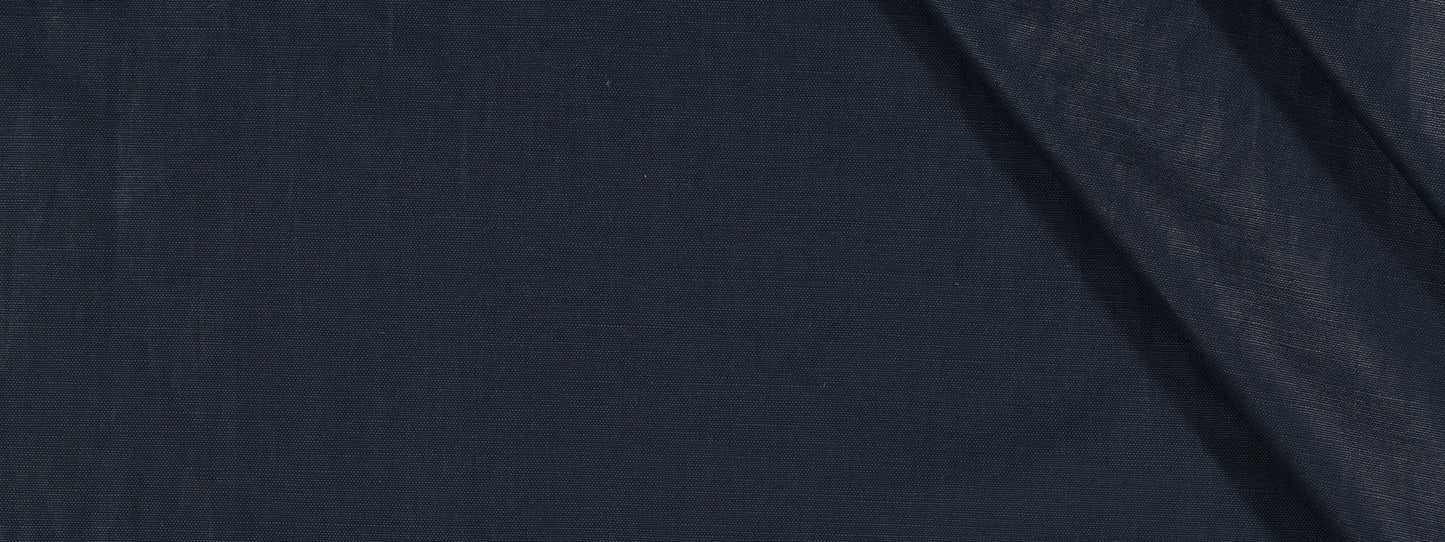Dark navy fabric close-up with diagonal fold; smooth upholstery fabric.