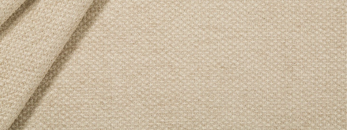 Beige woven fabric close-up with folds; linen-like texture, upholstery fabric for home decor.