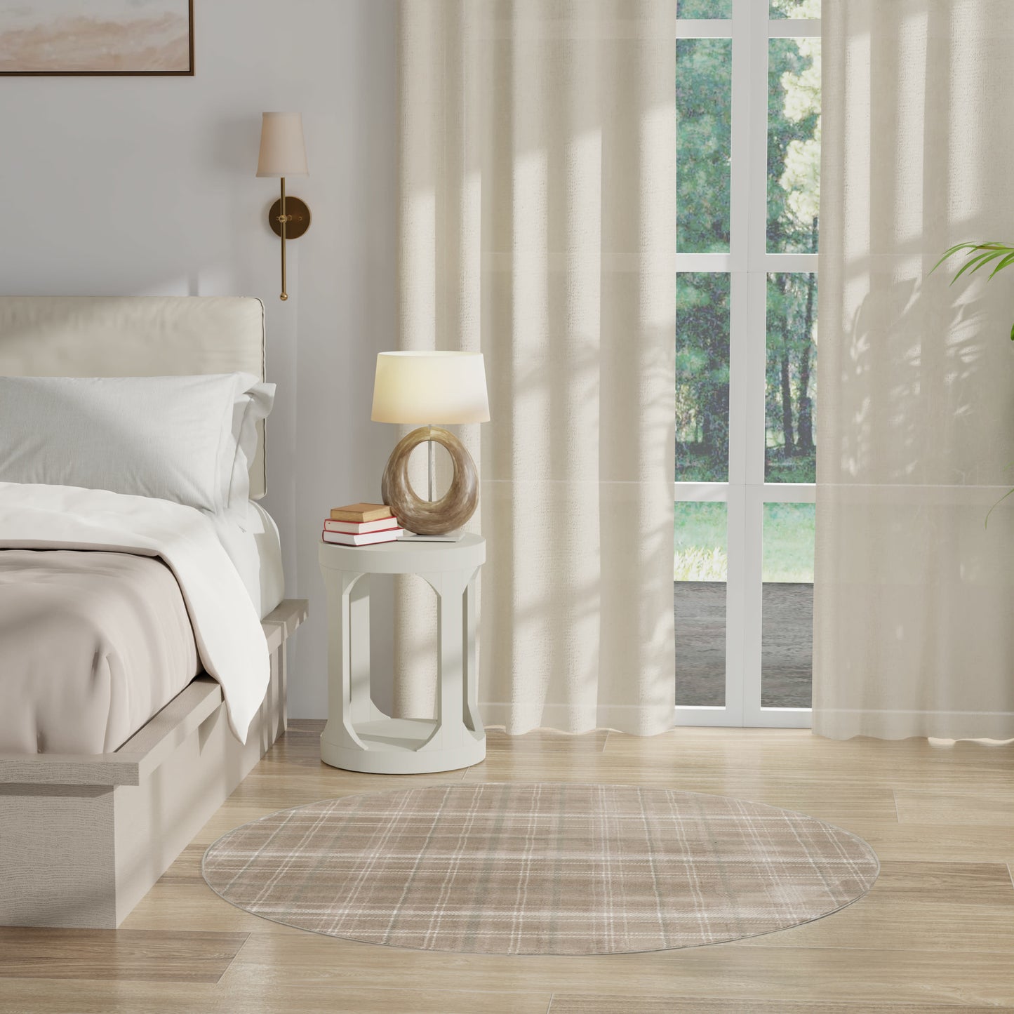 Neutral bedroom with round white open-frame nightstand, ring-base lamp, beige plaid round rug, sheer curtains.