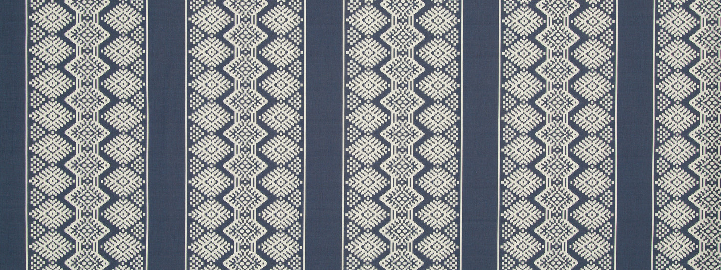 Navy blue and beige woven upholstery fabric with a geometric diamond pattern and vertical stripes.