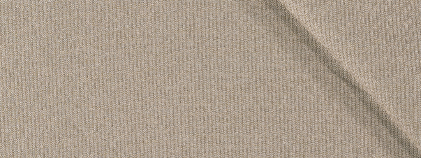 Close-up of beige ribbed fabric with a diagonal crease and fine knit texture.
