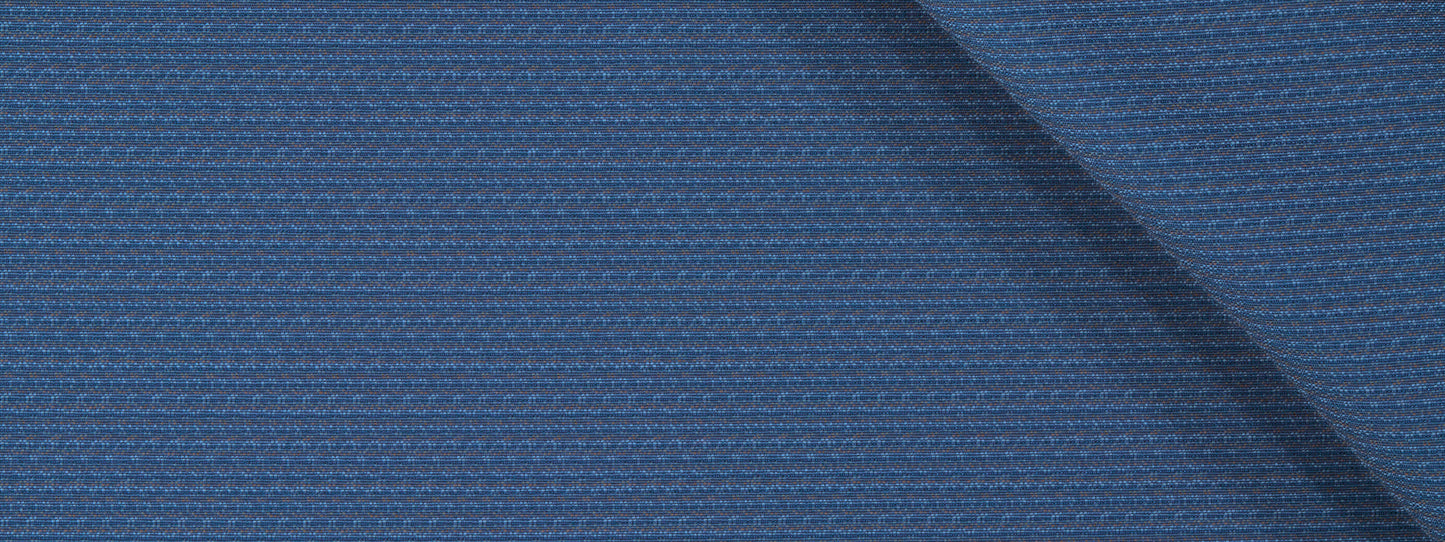 Close-up of blue textured upholstery fabric with a ribbed pattern and diagonal seam.