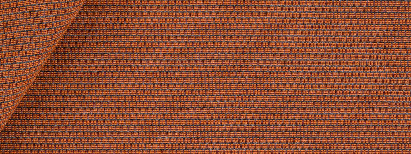 Orange-brown woven upholstery fabric with tiny navy checks; folded corner.