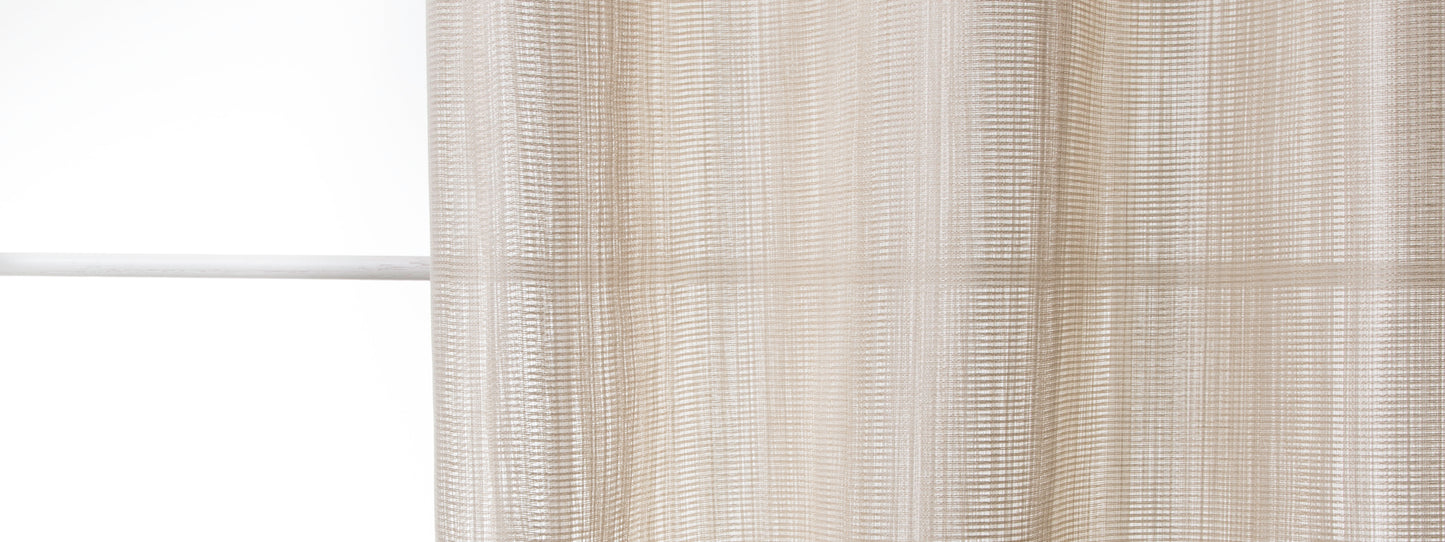 Cream-beige sheer curtain with woven vertical stripes, diffusing soft light at a window.