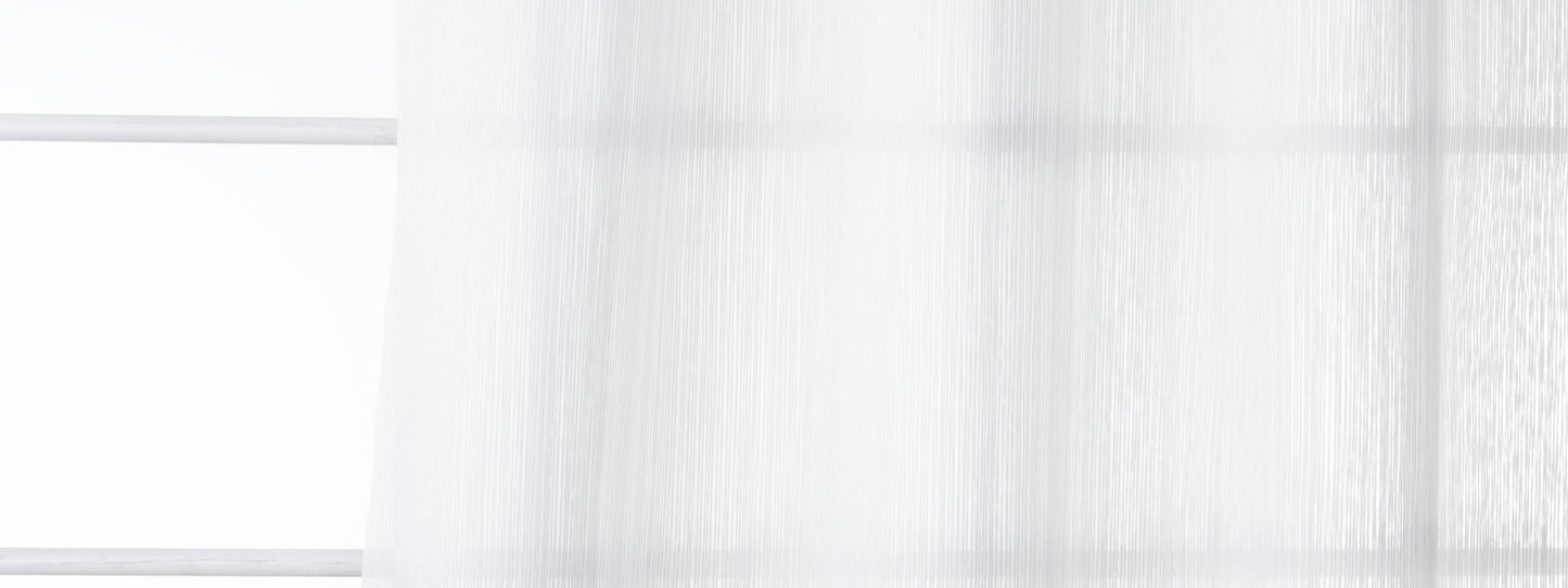 Bone-colored sheer drapery panel with soft folds diffusing natural light for an airy window look.