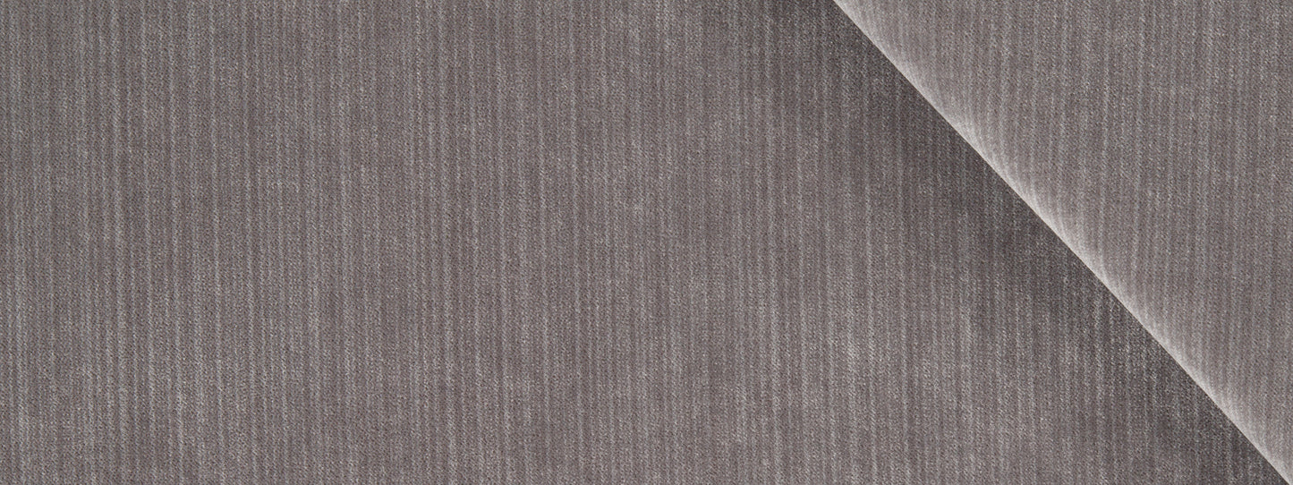 Gray corduroy fabric close-up with vertical ridges and a diagonal fold.
