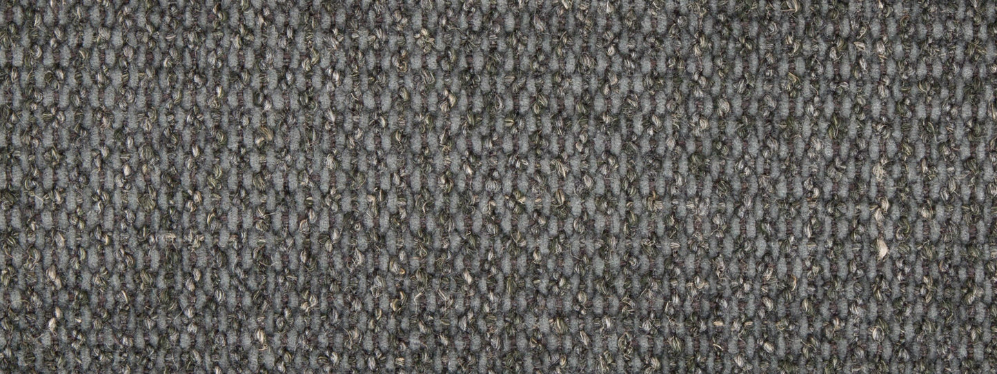 Close-up of blue coal pebble-weave upholstery fabric with subtle light flecks; durable upholstery texture.