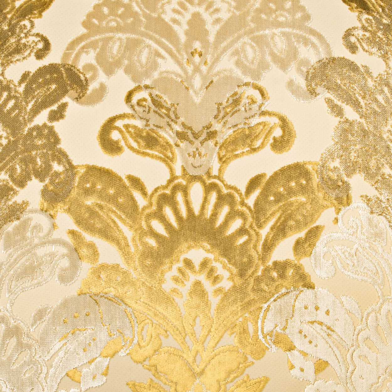 Gold damask fabric with ornate floral pattern on ivory background; luxurious upholstery or drapery textile.
