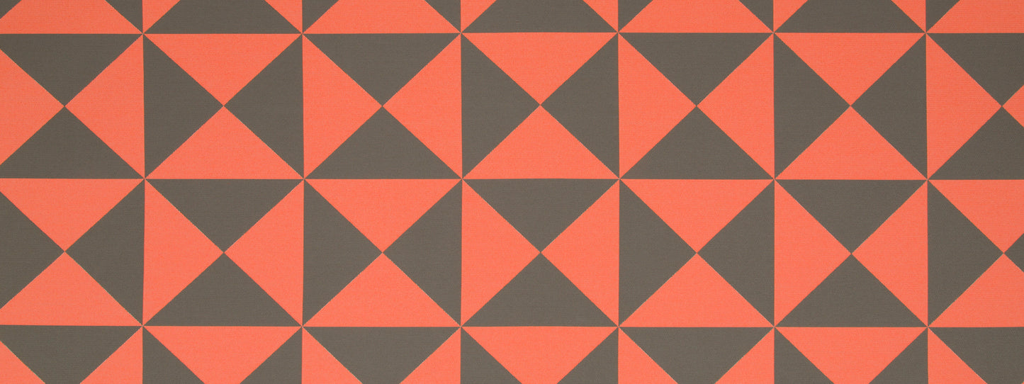 Orange and charcoal gray geometric pinwheel pattern of tessellated triangles; bold modern textile or wallpaper design.