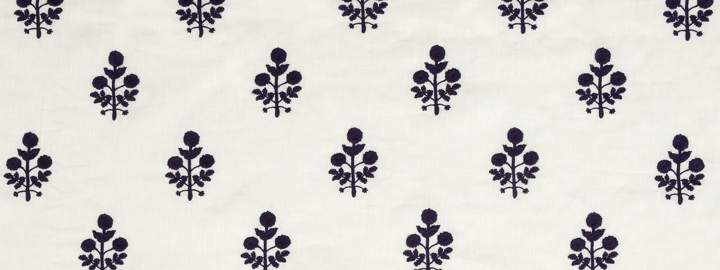 Dark purple floral motifs repeating on navy background; small botanical pattern for fabric, bedding, or apparel.