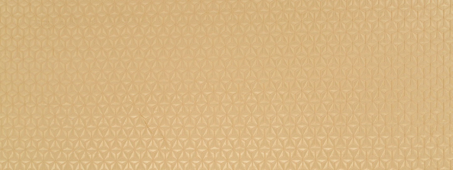 Golden beige textured drapery fabric with a subtle repeating geometric floral pattern and metallic sheen.