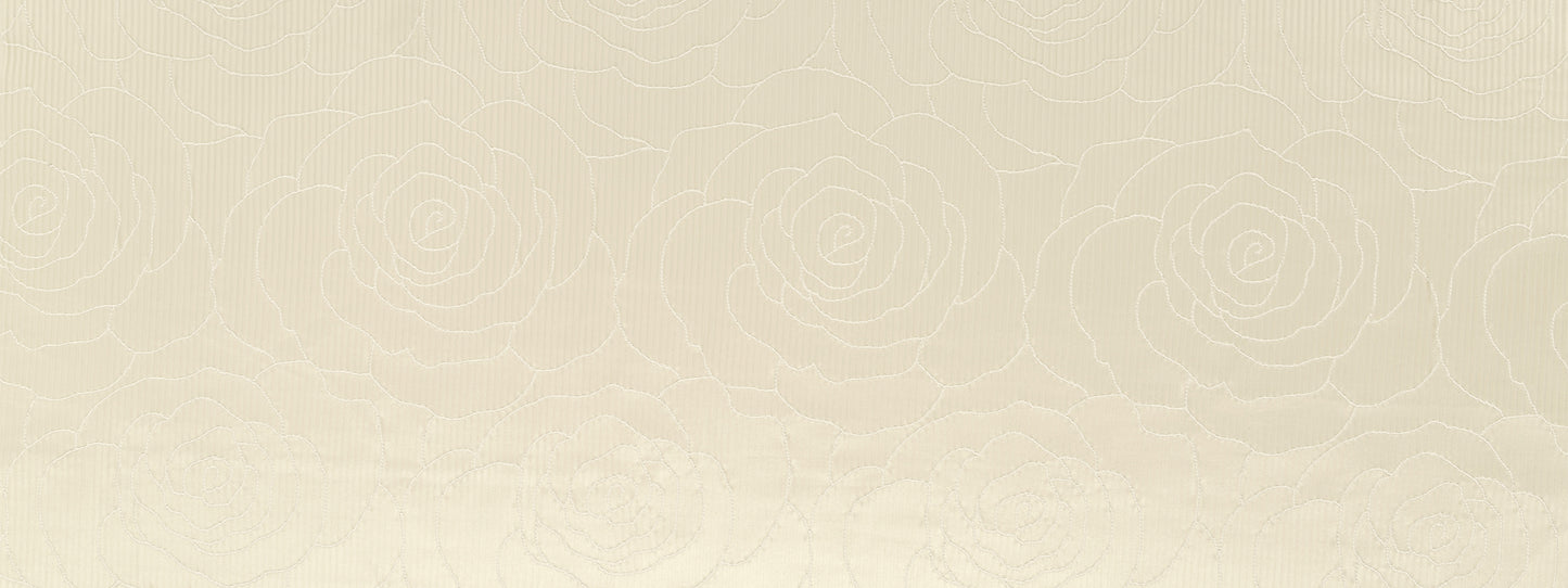 Cream textured drapery fabric with a subtle embossed rose pattern.