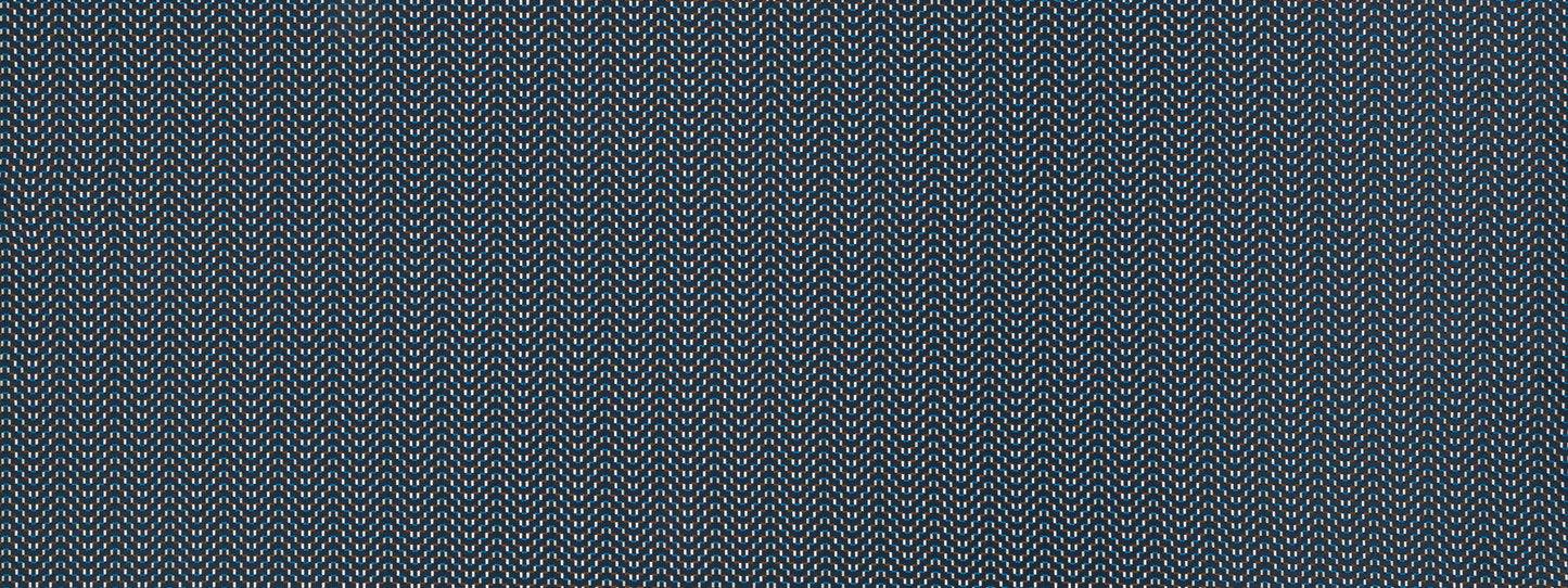 Close-up of blue woven fabric with subtle white flecks and textured diagonal weave.