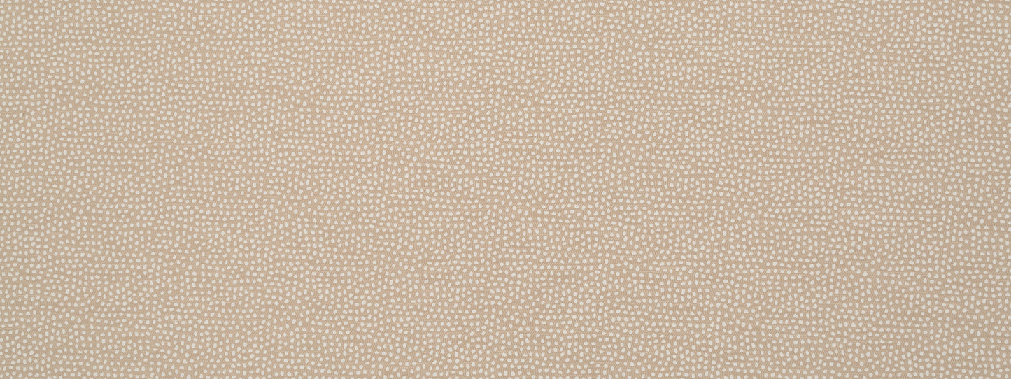 Beige dotted fabric close-up; soft woven texture with tiny white specks.