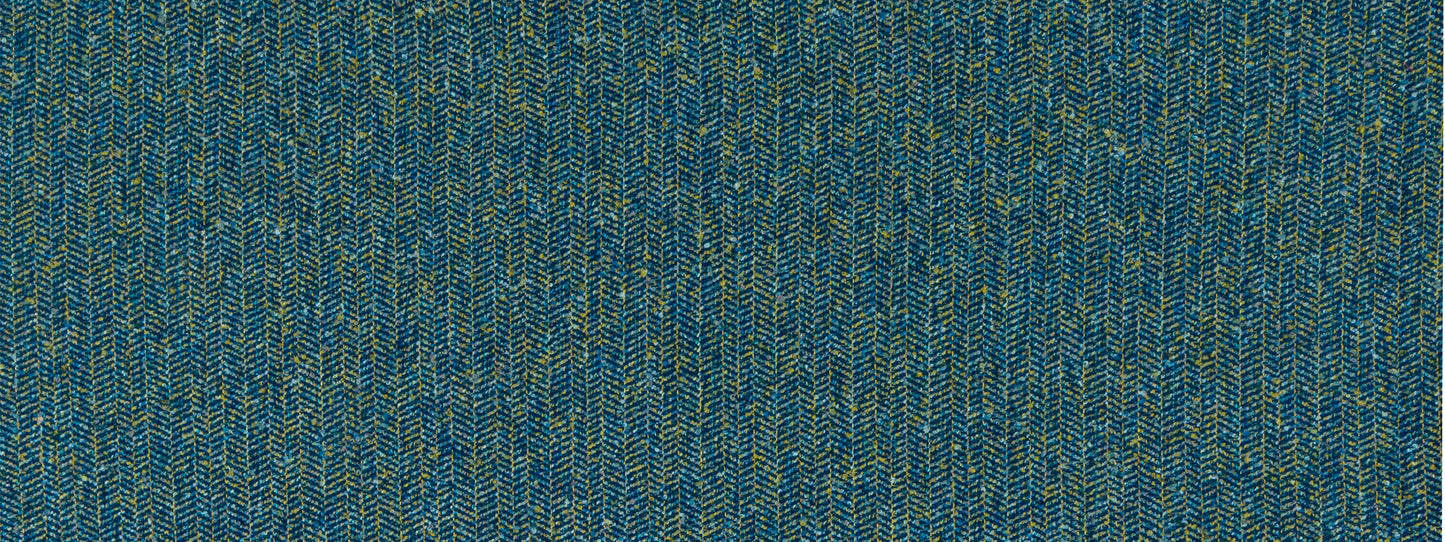 Blue herringbone tweed upholstery fabric with subtle yellow flecks.