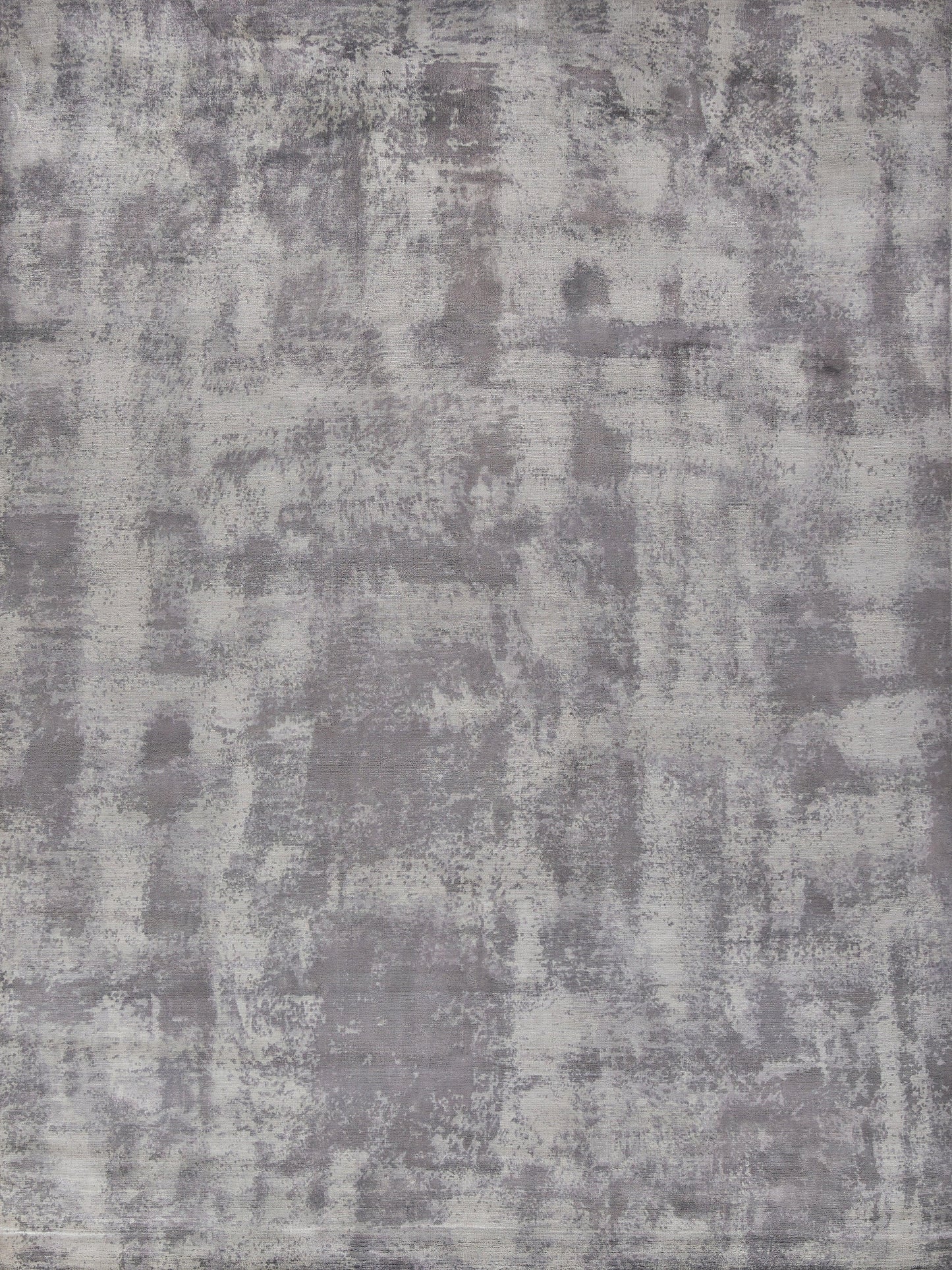 Textured area rug in shades of gray with an abstract pattern, featuring a soft, plush surface suitable for indoor use.